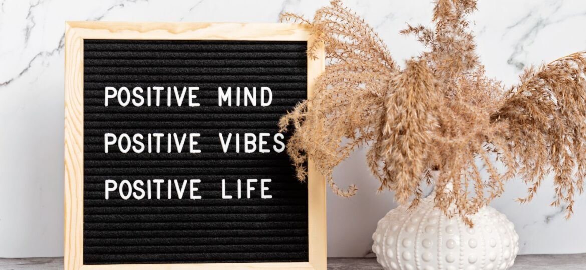 positive life written on a slate